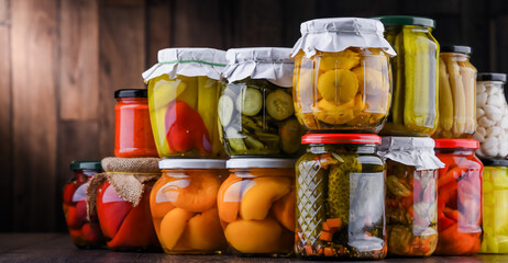 Jars with variety of marinated vegetables and fruits