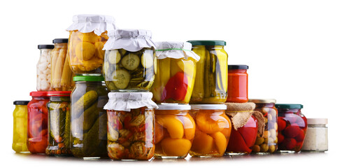 Jars with variety of marinated vegetables and fruits