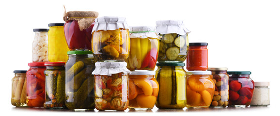 Jars with variety of marinated vegetables and fruits