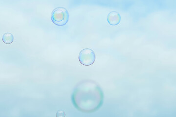 Soap bubbles on sky background