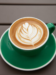 A cup of hot art latte, cappuccino 