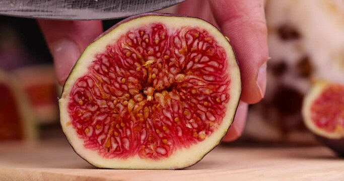 Sliced ripe purple figs with red pulp, delicious and fresh figs cut into slices