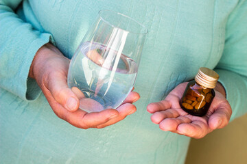 Senior woman taking a pills