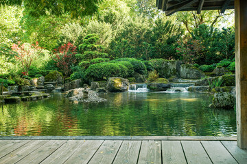 Small waterfalls in japanese garden and japanese maple  in Botanical garden in Augsburg