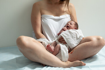 Woman with new born baby have a rest
