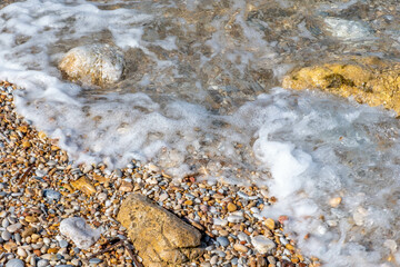 Pebbles on a beach at Kamares on Sifnos island in Greece