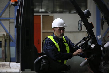 Man engineer standing on construction site or equipment maintenance work site.