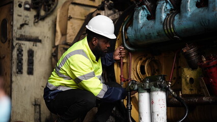 Portrait of maintenance engineer or apprentice in workshop of railway engineering facility