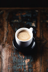 Cup of coffee on rustic wooden background. Close up. Copy space.