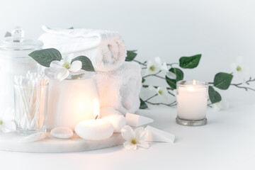 An arrangement of cleansing items all in white against a light background.
