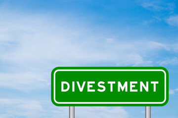 Green color transportation sign with word divestment on blue sky with white cloud background