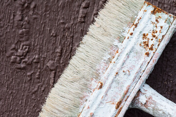 Painting works. Brush on a painted wooden surface. Background and blank for the inscription.