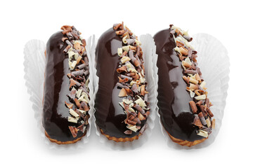 Delicious chocolate eclairs on white background