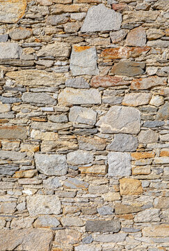Fond de mur en pierre rustique.
