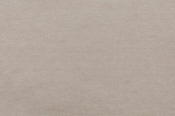 Beige lined fabric textured. Light white and beige stripes. Flat lay top view. Closeup background. 