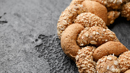 Fresh Homemade braided bread on rustic dark background