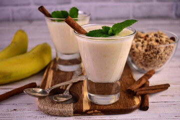 Banana dessert with cinnamon.Yogurt with banana and granola.
