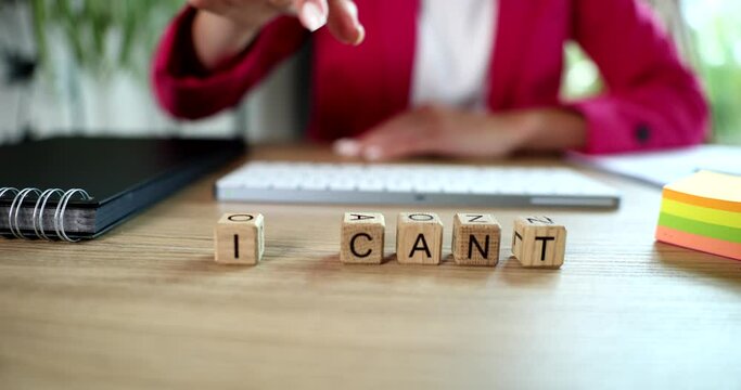 Businesswoman writing word i can not from cubes closeup 4k movie slow motion