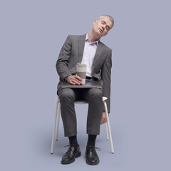 Businessman sitting on a chair and sleeping