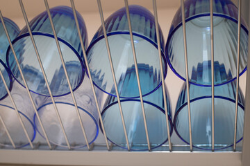Glasses turned upside down in a dish drainer.