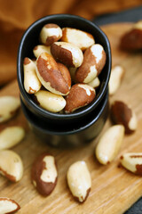 Macro. Large brazil nuts in a bowl. Peeled nuts.