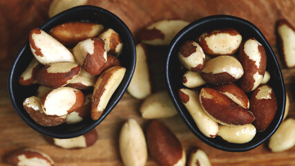 Macro. Large brazil nuts in a bowl. Peeled nuts.