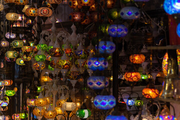 Fototapeta premium Colored lanterns on the background of the black night sky in the street