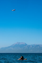 girl at the sea and aeroplane 