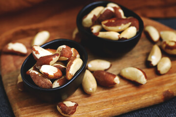 Macro. Large brazil nuts in a bowl. Peeled nuts.