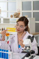 Portrait of Young Aisan Woman Doing Experiment in Laboratory