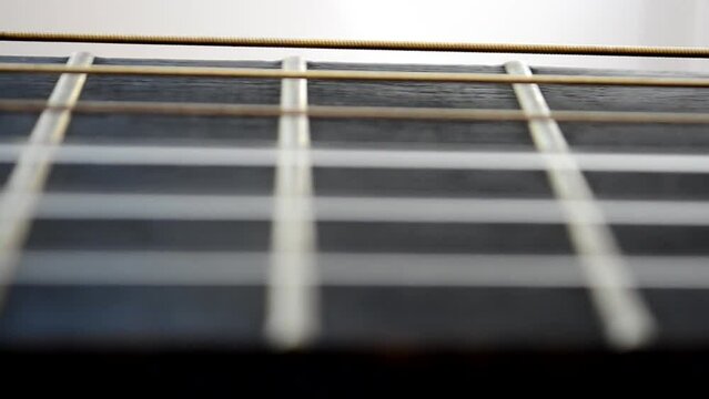 Shooting of a guitar. Guitar strings
