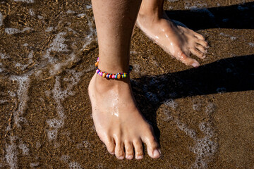 feet on the beach