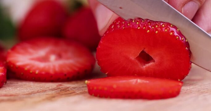 Cut into pieces ripe red strawberries