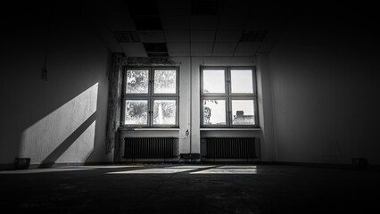 Light falls through two old windows