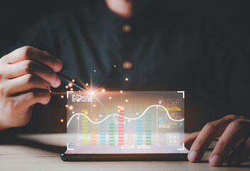 Graphs and Charts show on Computer's Screen.Investor analyzing financial reports of stock trading.Investor analyzing financial reports of stock trading