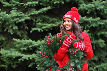 Woman with a wreath looking back to copy space area