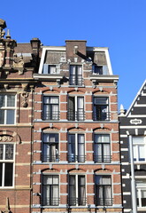 Obraz premium Amsterdam Nieuwezijds Street Historic Residential Building Facade, Netherlands.