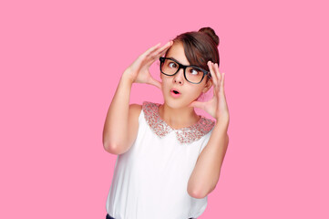 Brunette girl in a pink studio having a head spinning