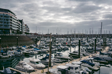 Boats moored at low tide at the Elizabeth Marina