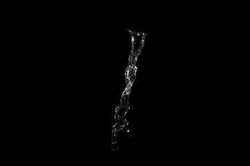 Fototapeta na wymiar water splashes isolated on black background. white jets with drops