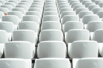 Seats of tribune on sport stadium. Concept of fans, chairs for audience, cultural environment concept. mpty seats, modern stadium.