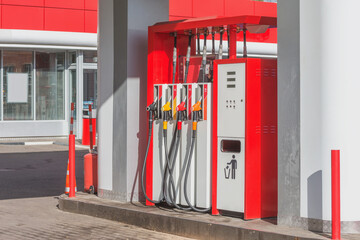 Guns for refueling at a gas station.