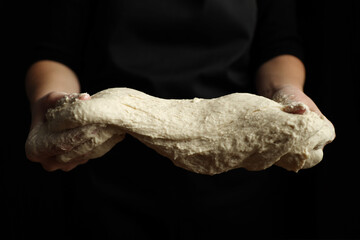 Yeast dough growth process, bread sourdough in hands.