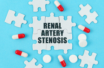 On a blue background, pills, capsules and puzzles with the inscription - Renal artery stenosis