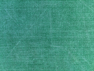 Green old denim close-up for background