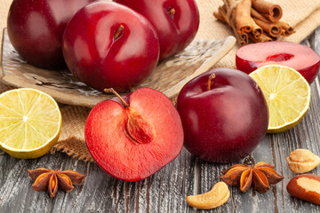 sliced plum group on wood background