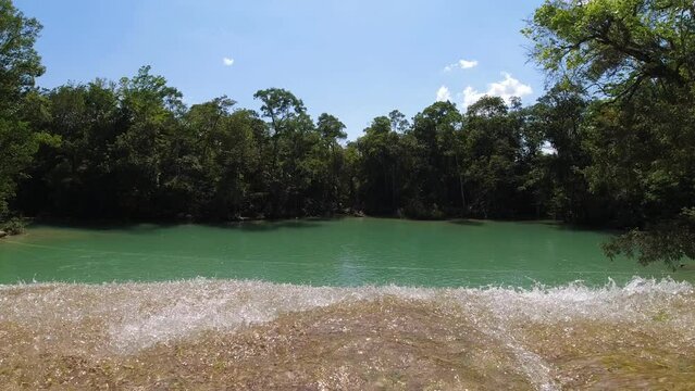 At the precipice of a waterfall in the jungle of Latin America (Cascadas Roberto Barrios Mexico)