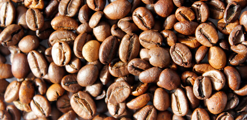 close-up of coffee beans as background, top view on brown coffee beans, coffee background