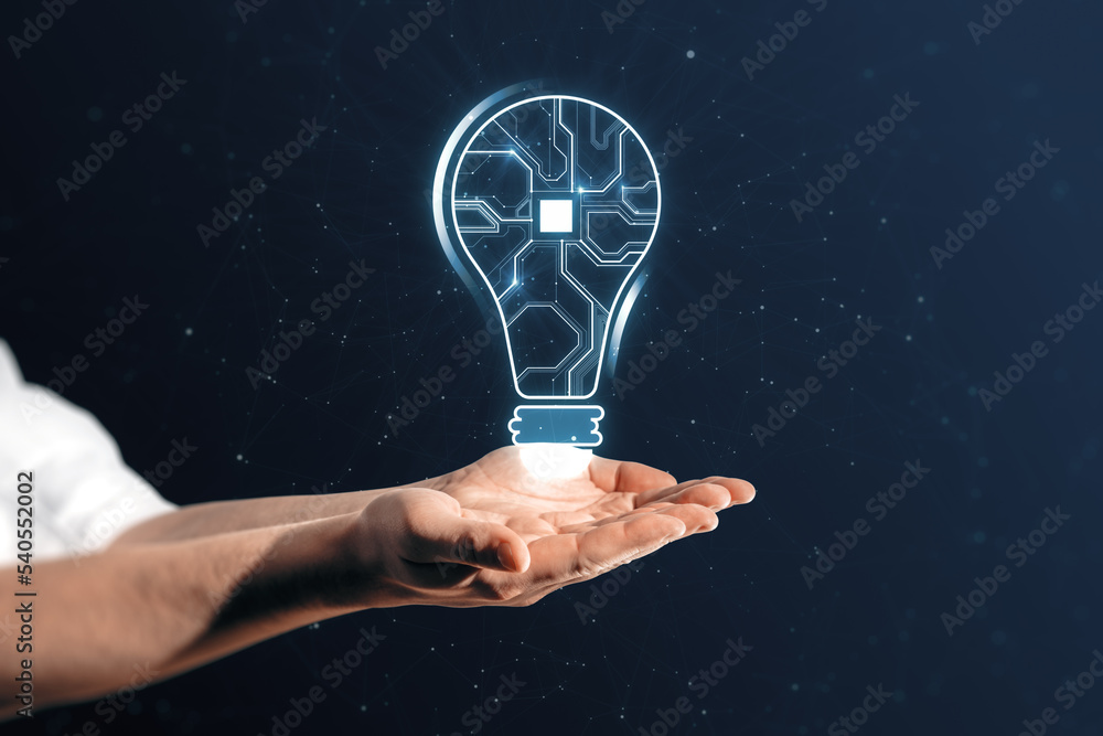 Poster Close up of businessman hands holding abstract glowing light bulb with chip hologram on blurry dark background. Artificial intelligence and neural network concept.
