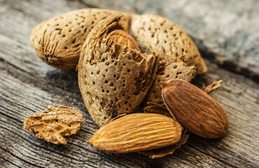 Almonds in shell and peeled almond copy space